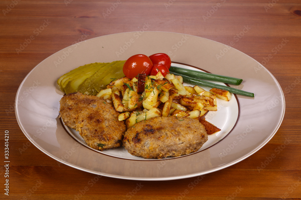 Homemade cutlet with roasted potato Homemade cutlet with roasted potato