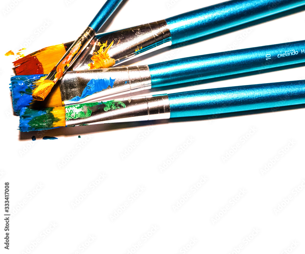 Fototapeta premium Used Paintbrushes with Color isolated on white