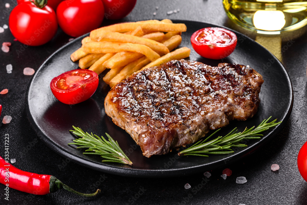 Ribeye steak with potatoes, onions and cherry tomatoes Ribeye steak with potatoes, onions and cherry tomatoes