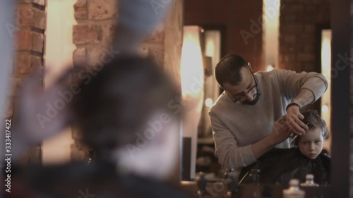 Wallpaper Mural Hairdresser cutting hair of child in Barbershop Torontodigital.ca