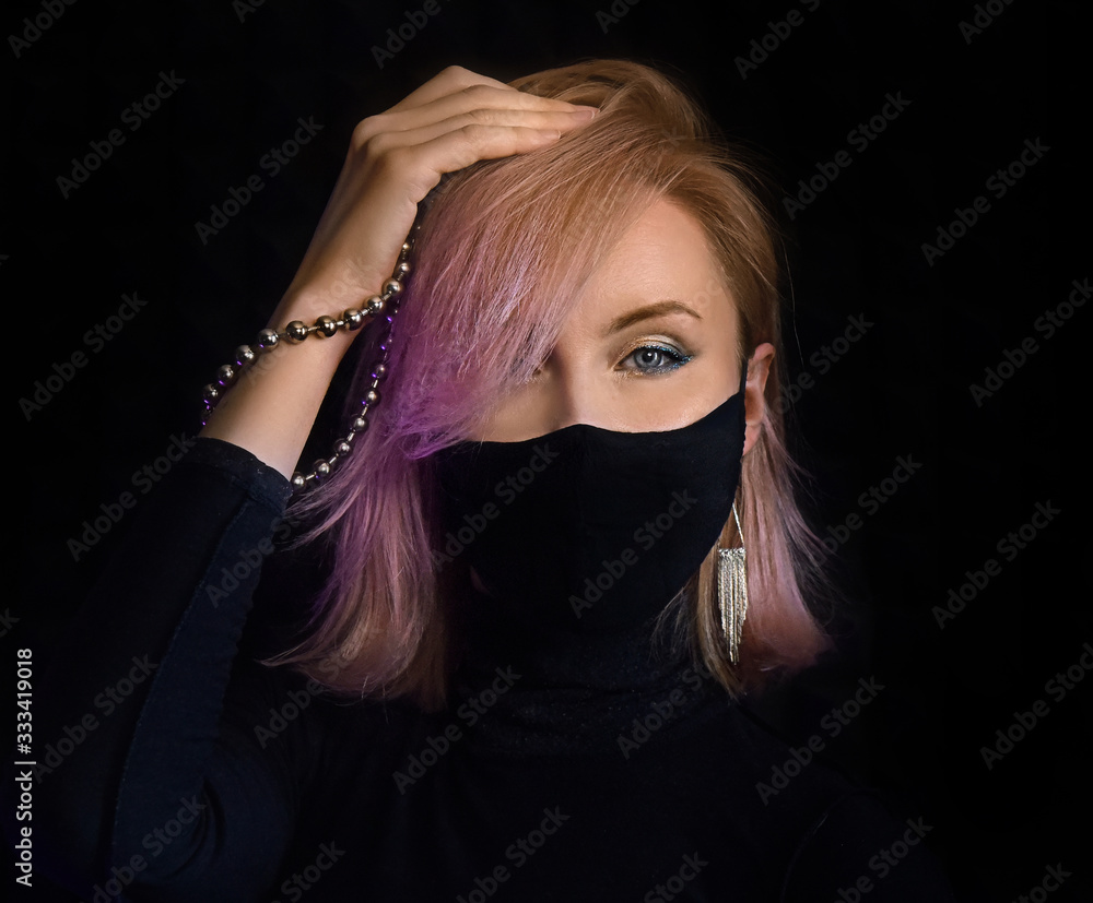 neon lights woman in surgical mask against coronavirus poses for