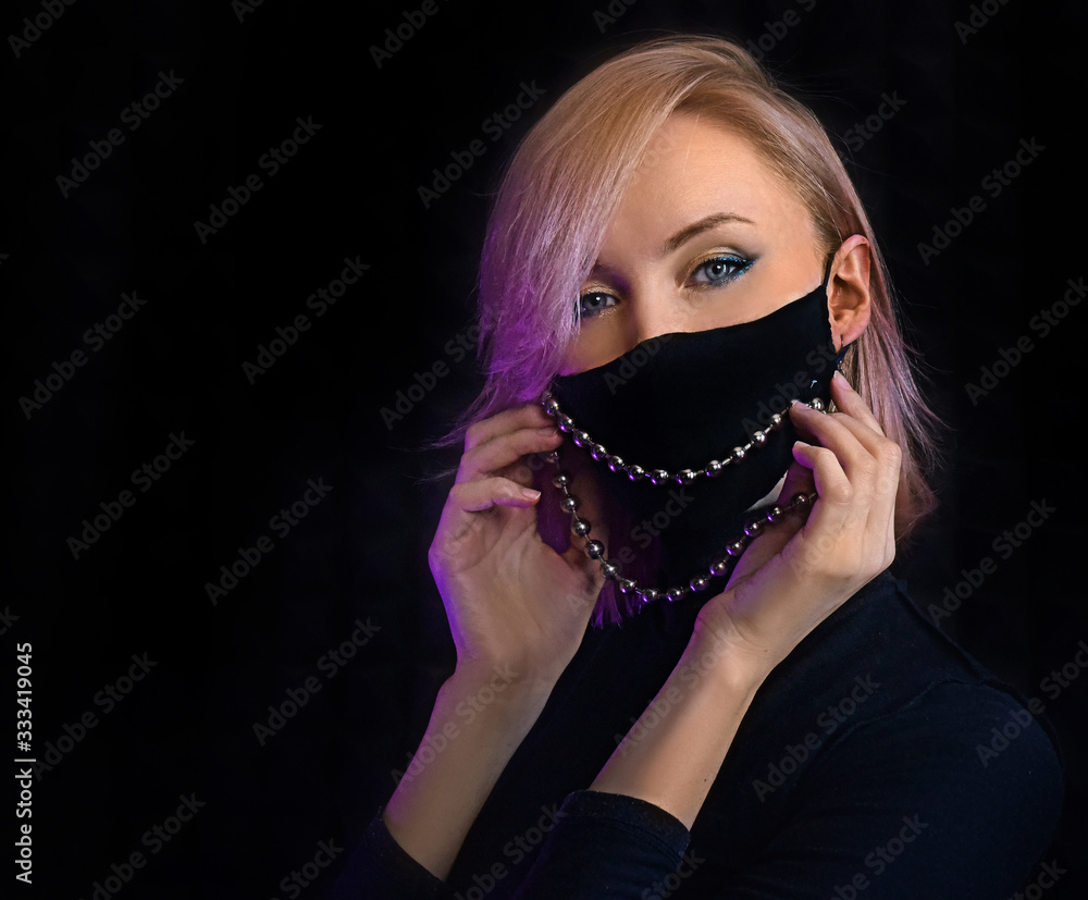 neon lights woman in surgical mask against coronavirus poses for