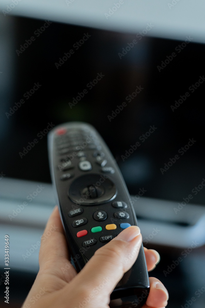 Closeup view of remote control laying on the palm Closeup view of remote control laying on the palm
