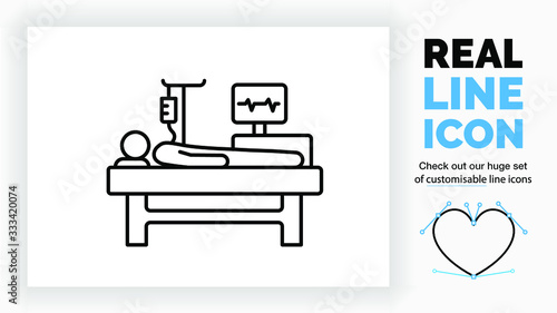 Editable real line icon of a patient in a hospital bed on the intensive care with an IV and a heart monitor measuring his pulse in black modern lines on a clean white background