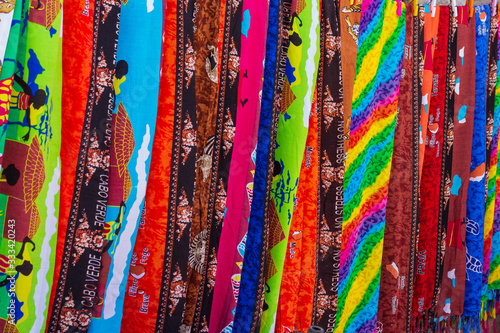 Canvas Print Colourful neck scarves and fabric on display photographed in Cape Verde