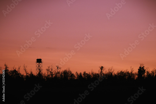 Silhouette of a Guard tower against the evening sky