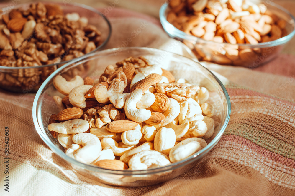 nuts are placed in glass plates, a healthy food concept