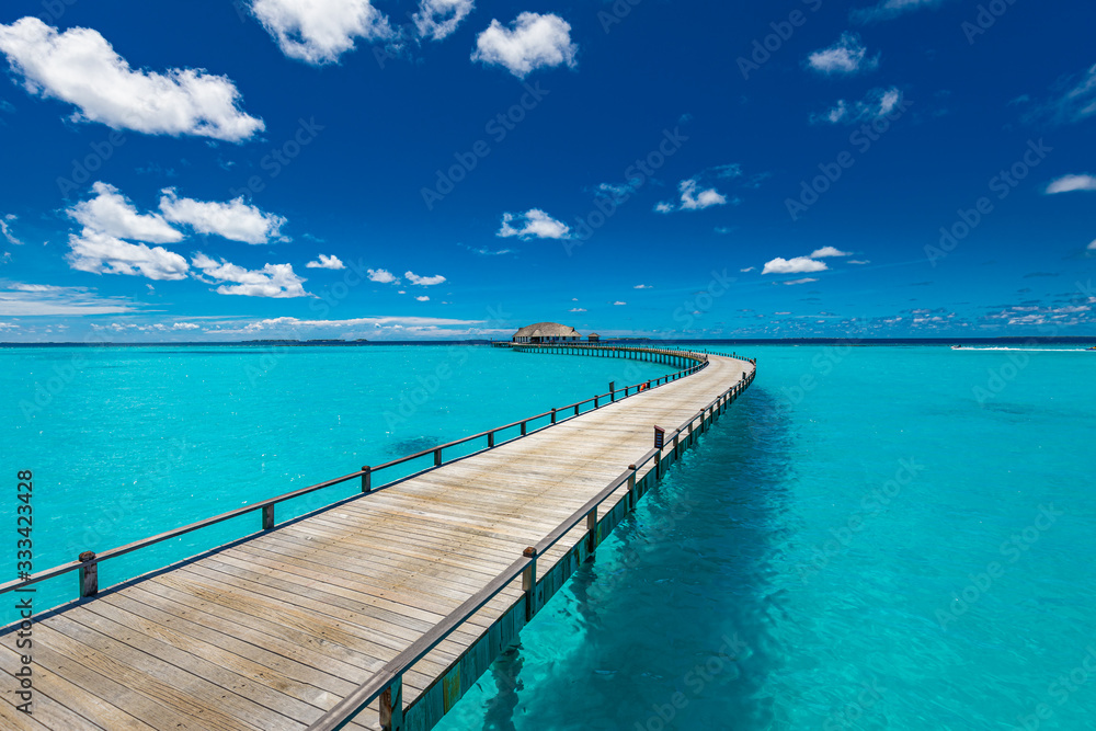 Fantastic landscape of Maldives beach. Tropical panorama, luxury water villa resort with wooden pier or jetty. Luxury travel destination background for summer holiday and vacation concept.