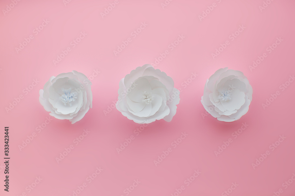 Handmade paper art and cut white flower on pink background. Handmade paper art and cut white flower on pink background.