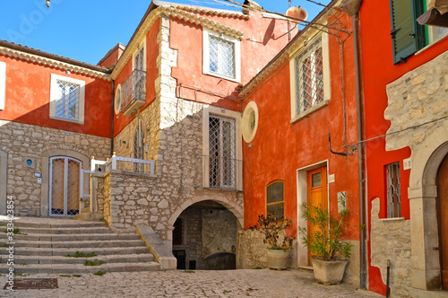 Fototapeta Naklejka Na Ścianę i Meble -  A narrow street between the houses of Morcone, a medieval village in the Campania region in Italy