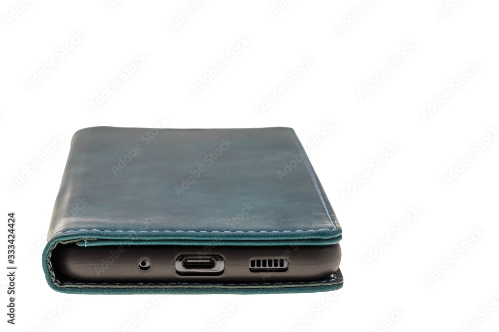 Close up view of mobile phone in green case isolated on white background. Communication concept. Close up view of mobile phone in green case isolated on white background. Communication concept.