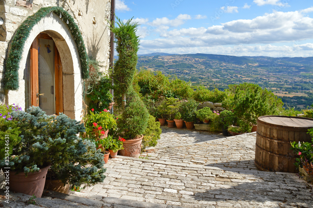 Fototapeta premium A narrow street between the houses of Morcone, a medieval village in the Campania region in Italy