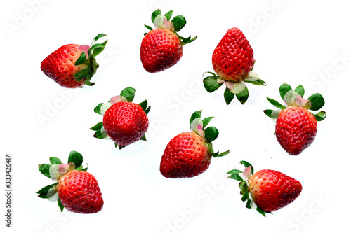 Strawberry Pattern made of eight berries in a different positions isolated on a white background