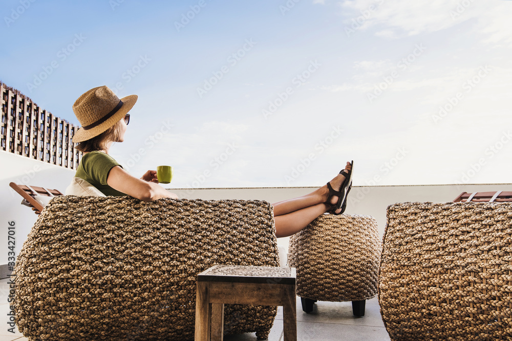 Young woman resting on terrace at home, beautiful girl enjoying life, vacations, relaxation and summer fun concept - obrazy, fototapety, plakaty 
