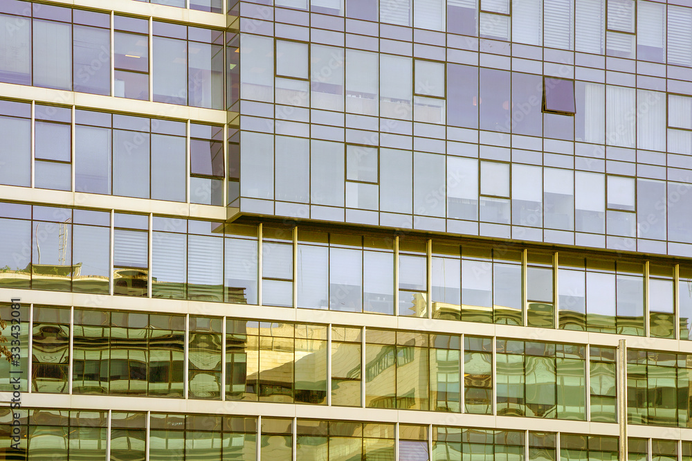 Abstract architecture. Glass blue square Windows of facade modern city business building skyscraper. The texture of the windows of the building. Abstract architecture. Glass blue square Windows of facade modern city business building skyscraper. The texture of the windows of the building.