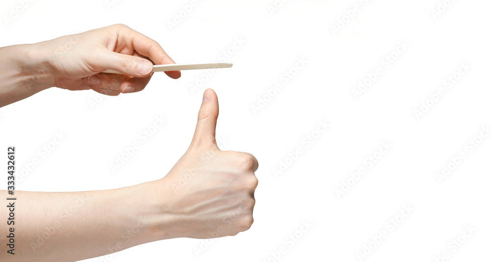 Man do manicure at home. Self hand routine. Copy space for text. Male finger procedure. White background isolated. Copyspace. Thumb fingernail clean. Man manicurist service. Horizontal Man do manicure at home. Self hand routine. Copy space for text. Male finger procedure. White background isolated. Copyspace. Thumb fingernail clean. Man manicurist service. Horizontal