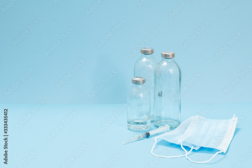 Medical masks, syringe and bottles for liquid medicine. Medical masks, syringe and bottles for liquid medicine.