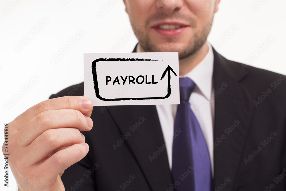 Business, Technology, Internet and network concept. Young businessman working on a virtual screen of the future and sees the inscription: Payroll Business, Technology, Internet and network concept. Young businessman working on a virtual screen of the future and sees the inscription: Payroll