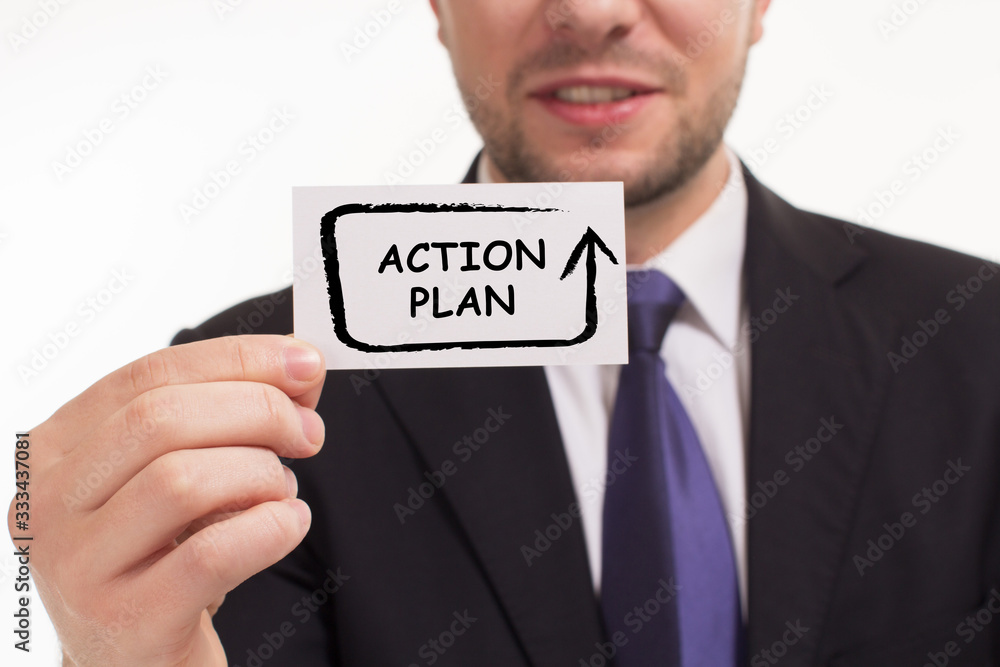 Business, Technology, Internet and network concept. Young businessman working on a virtual screen of the future and sees the inscription: Action plan Business, Technology, Internet and network concept. Young businessman working on a virtual screen of the future and sees the inscription: Action plan