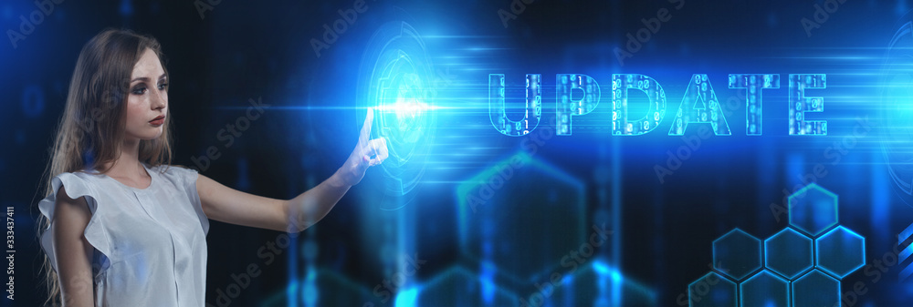 Business, Technology, Internet and network concept. Young businessman working on a virtual screen of the future and sees the inscription: Update Business, Technology, Internet and network concept. Young businessman working on a virtual screen of the future and sees the inscription: Update