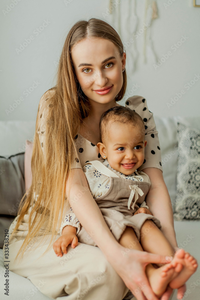 Happy mom and girl in home interior. Mothers Day. Happy mom and girl in home interior. Mothers Day.