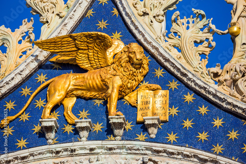 The pediment is decorated with a golden lion