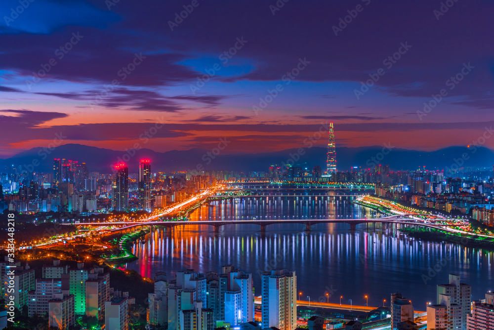 Seoul city skyline, Hangang River and Lotte World mall at nigth in South Korea.