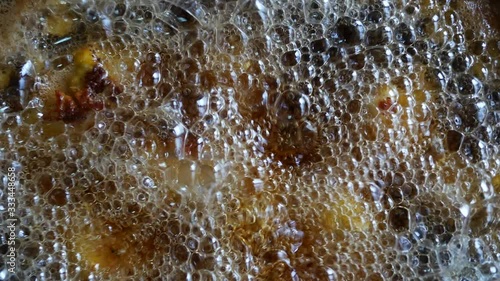 Fried chicken with boiling oil in a pan