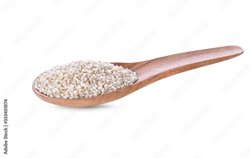 White sesame seeds in a wooden spoon isolated on a white background White sesame seeds in a wooden spoon isolated on a white background
