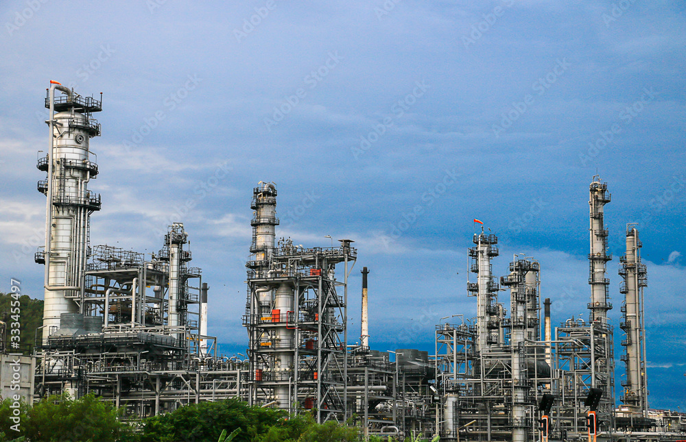 Oil refinery industry and Petrochemical and natural gas and oil storage tanks, blue background Oil refinery industry and Petrochemical and natural gas and oil storage tanks, blue background