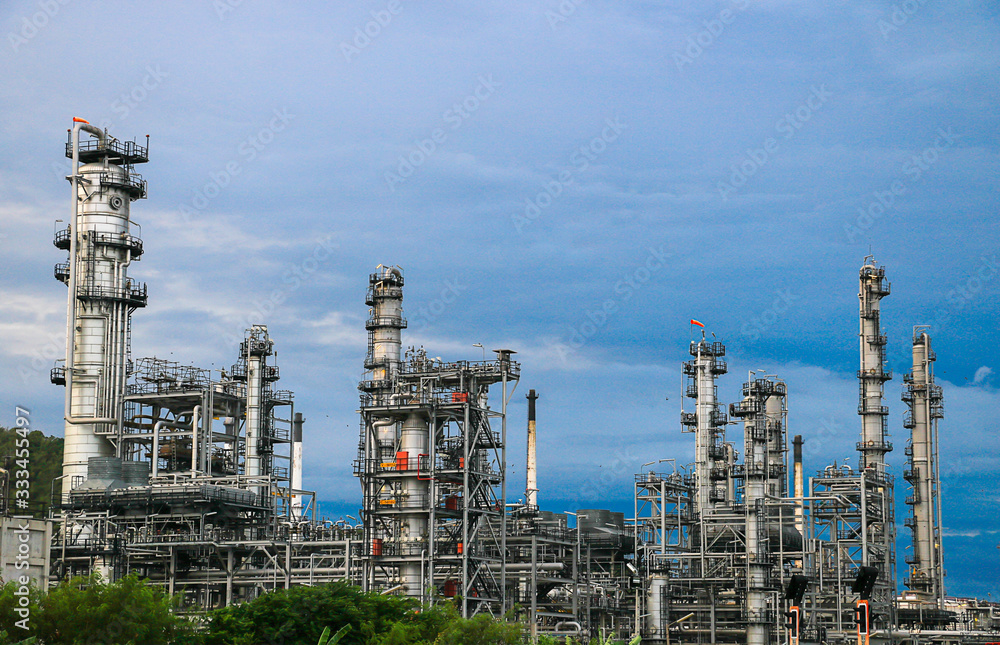 Oil refinery industry and Petrochemical and natural gas and oil storage tanks, blue background