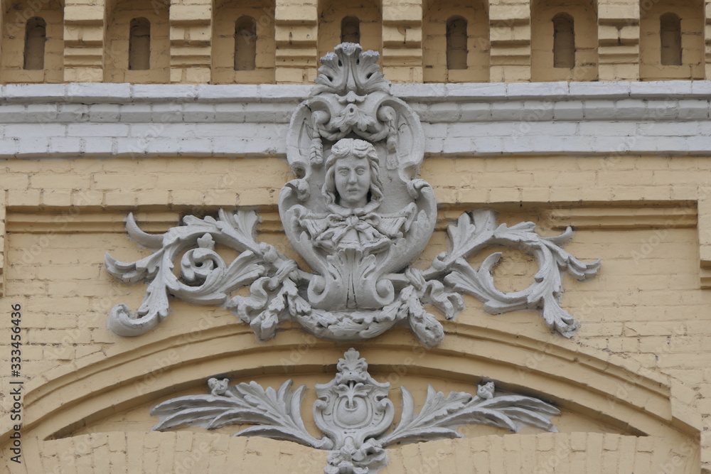 coat of arms. Bas-relief on the facade of an old house
