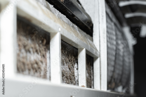 Dirty split air conditioner with dust and fungus. Close-up on a air conditioner that needs cleaning. photo