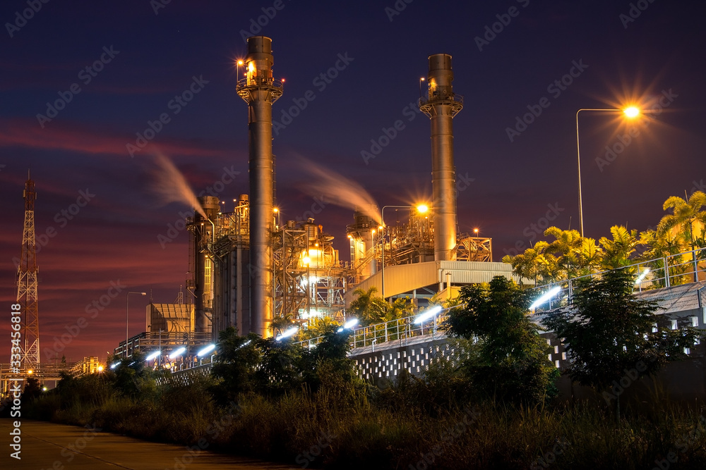 Natural Gas Combined Cycle Power Plant with sunset and light orange