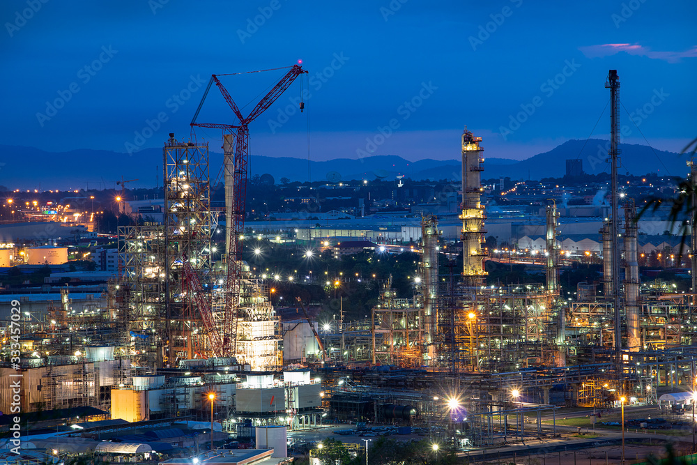 Refinery and industrial natural gas tanks with the backdrop of the morning sky