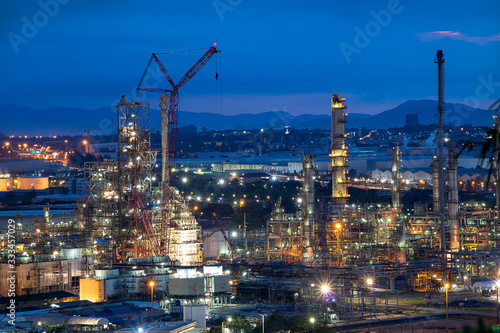 Refinery and industrial natural gas tanks with the backdrop of the morning sky