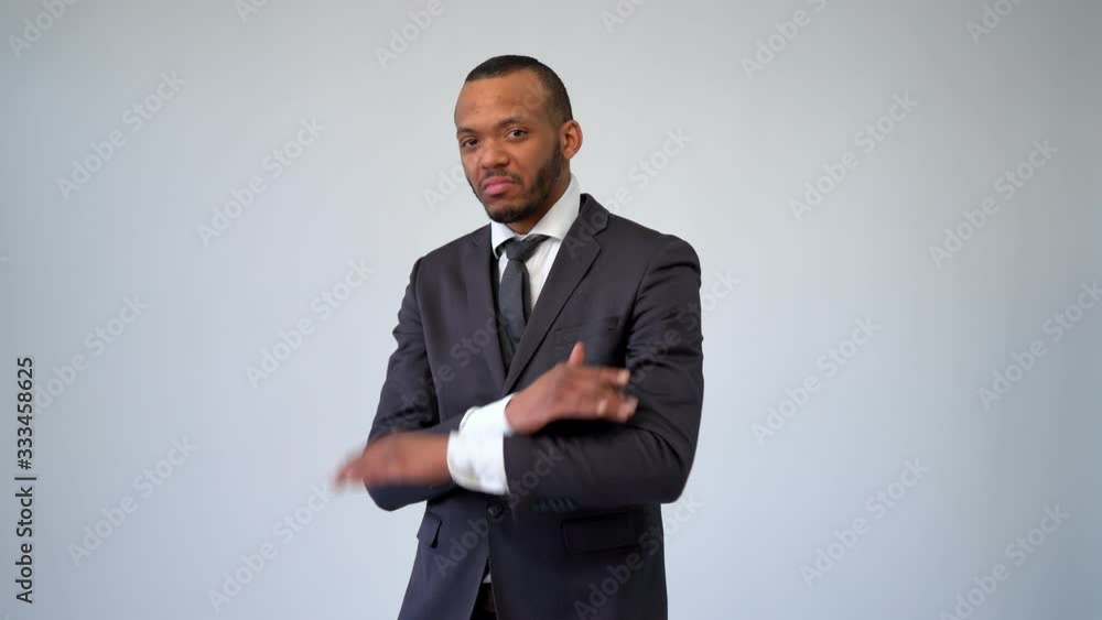 professional african-american business man - showing stop or no sign with crossed arms professional african-american business man - showing stop or no sign with crossed arms
