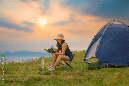 Young Woman Camping at Lake Relaxation Freedom Solitude Concept.
