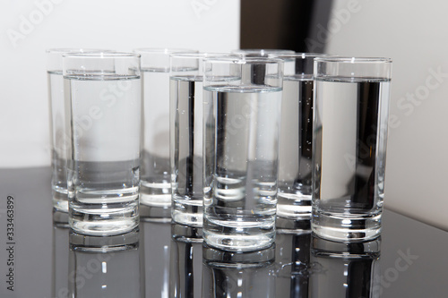 Group of water glasses on the shelf