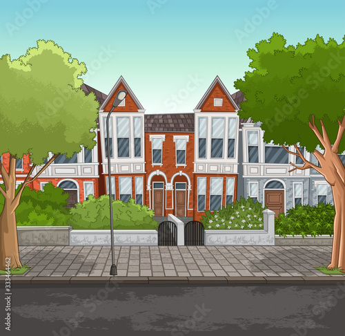 Colorful houses in suburb neighborhood. Street with trees and gardens.