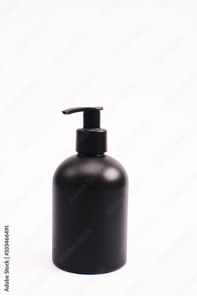 black bottle with body lotion isolated on white black bottle with body lotion isolated on white