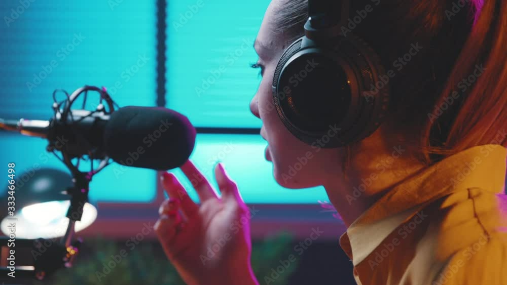 Young radio host talking into the microphone