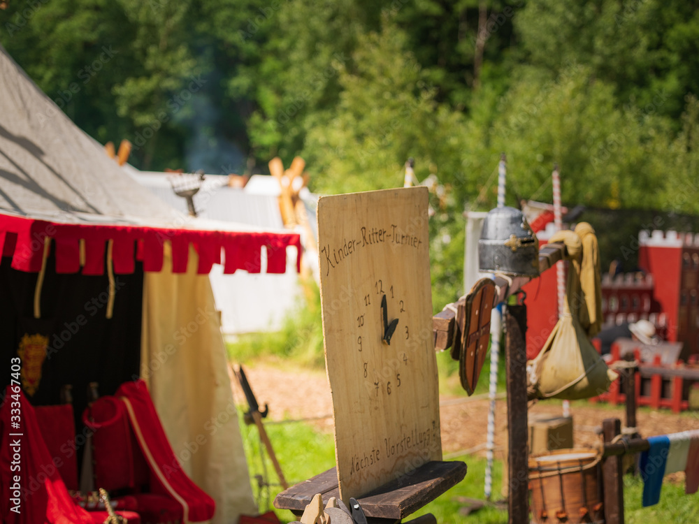 Clock for next knight fight during a medieval festival on a sunny weekend Clock for next knight fight during a medieval festival on a sunny weekend