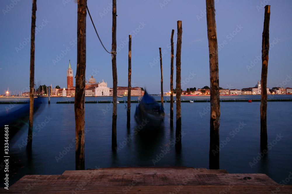 Long exposure view of gondolas and San Giorgio Maggiore across the Grand Canal, Venice, Italy Long exposure view of gondolas and San Giorgio Maggiore across the Grand Canal, Venice, Italy