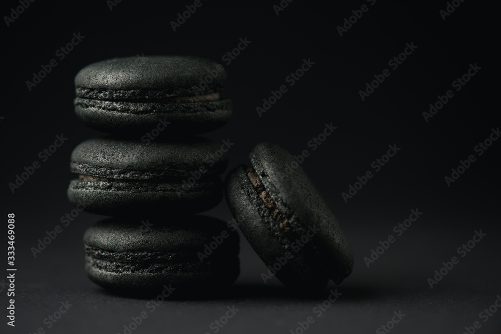 tasty and dark macarons on black with copy space tasty and dark macarons on black with copy space
