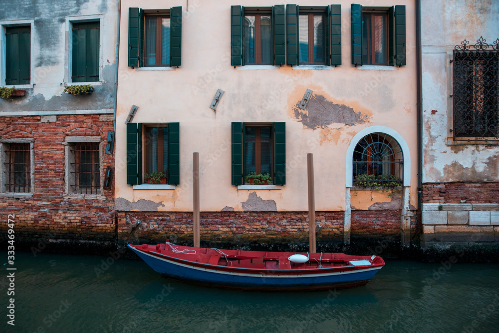 Colorful Boat in Canal in Venice Italy