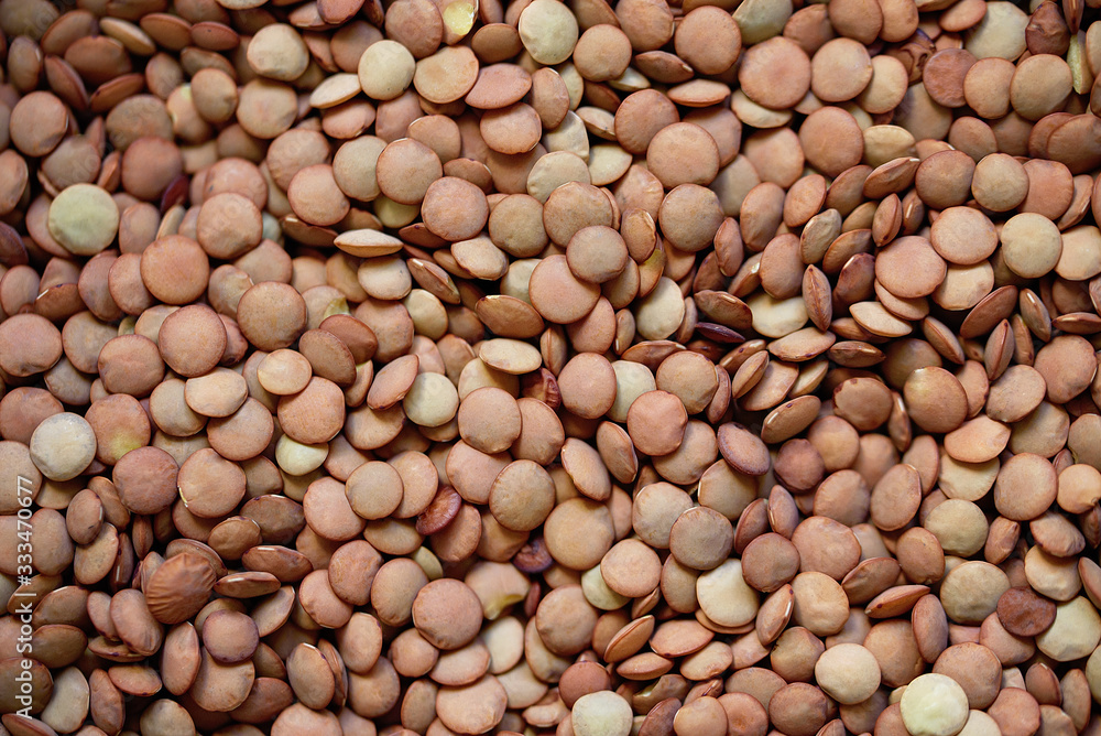 Pile lentil background. Top view. Flat lay. Vegetarian and vegan diet. High content of B vitamins in lentils. healthy Superfood Pile lentil background. Top view. Flat lay. Vegetarian and vegan diet. High content of B vitamins in lentils. healthy Superfood