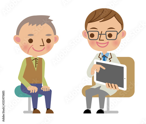 タブレット端末を使って患者へ説明する問診中の医師
