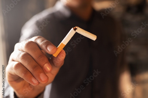 Man refusing cigarettes concept for quitting smoking and healthy lifestyle dark  background. or No smoking campaign Concept.	