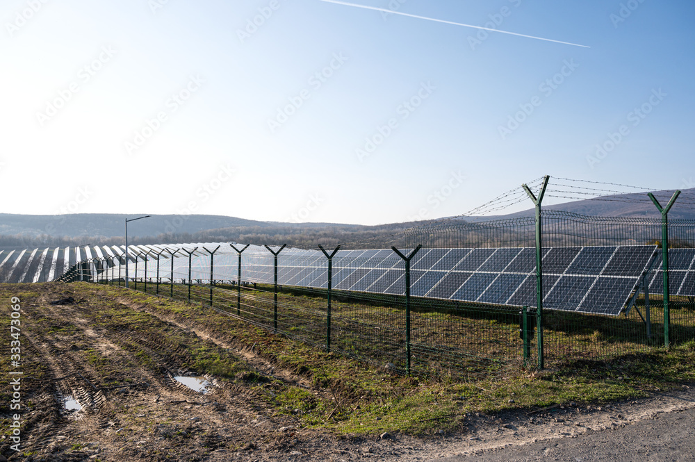 View of a solar energy station on a field.